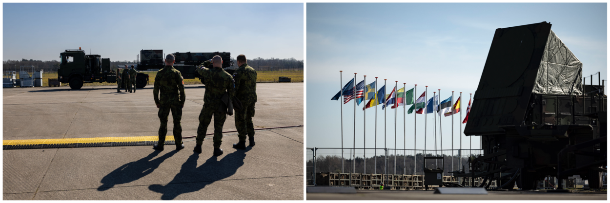 Een Patriot luchtverdedigingswapensysteem&nbsp;voor een rij met vlaggen van alle deelnemende landen.