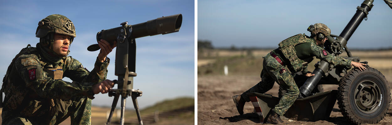 Militair gebruikt een kijker. Militairen duwen de mortier naar de juiste plek.