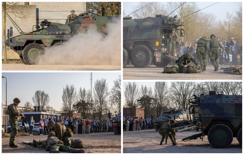 Militairen demonstreren hoe ze gewonden behandelen op het slagveld. Ze halen hen in dit geval op met een Boxer-voertuig.