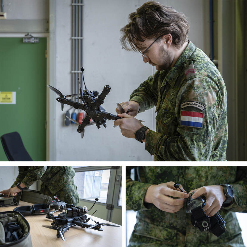 Kanonnier-1 Glenn bereidt de Griffon voor om ermee te vliegen. Hij bereidt de controller voor en draait de kleine propellers vast op de drone.